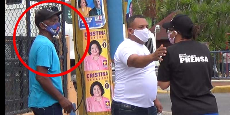 El hombre del círculo, con el tapabocas de Luis Abinader, salió del grupo del PRM a provocar